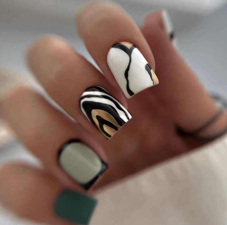Абстрактный маникюр зебра с зелеными ногтями